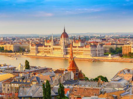 image of a large beautiful old building on a sunny day surrounded by city