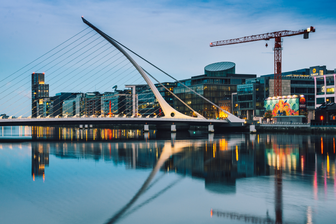 image of a modern bridge at night time in a city